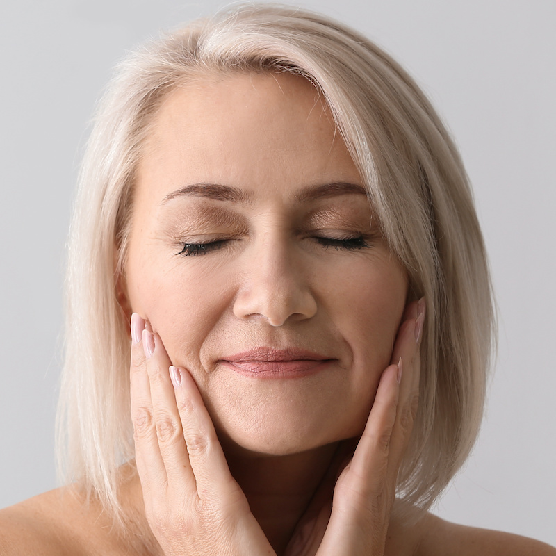 Fat Transfer older woman with her eyes closed