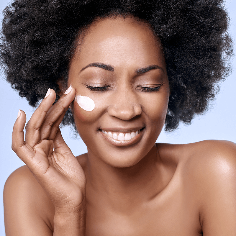 skincare products older woman applying skincare products