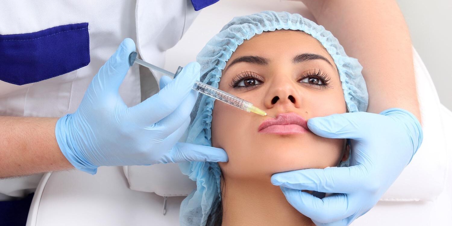 woman receiving injection into her lips