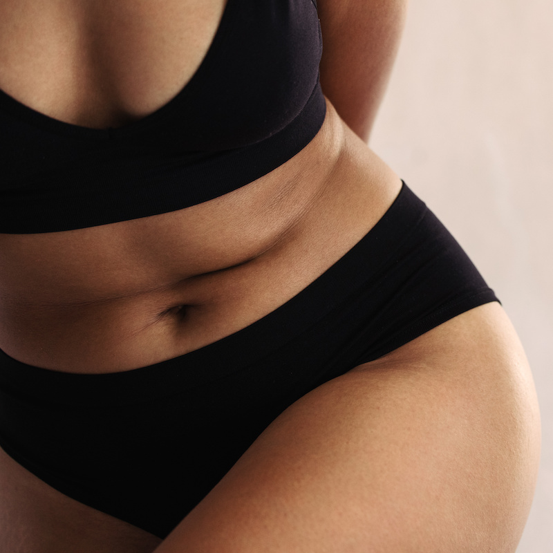 woman's stomach, black underwear